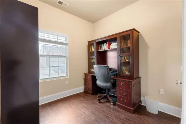 a work room with furniture and a window