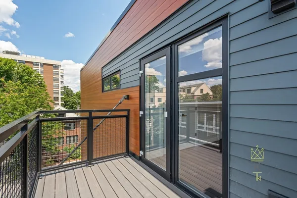 a view of balcony with wooden floor