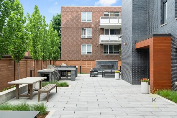 a view of a building with outdoor seating