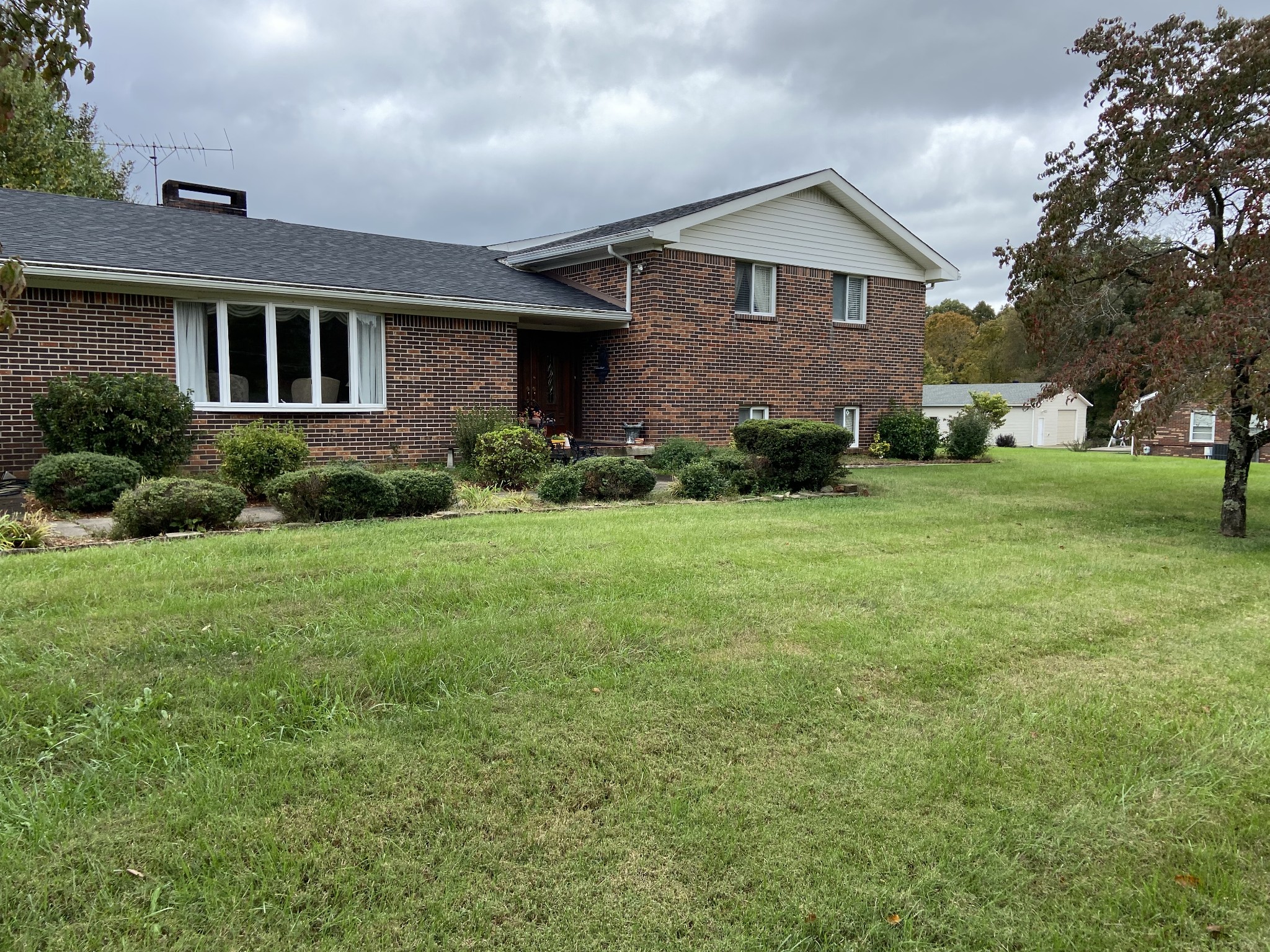 a front view of a house with a yard