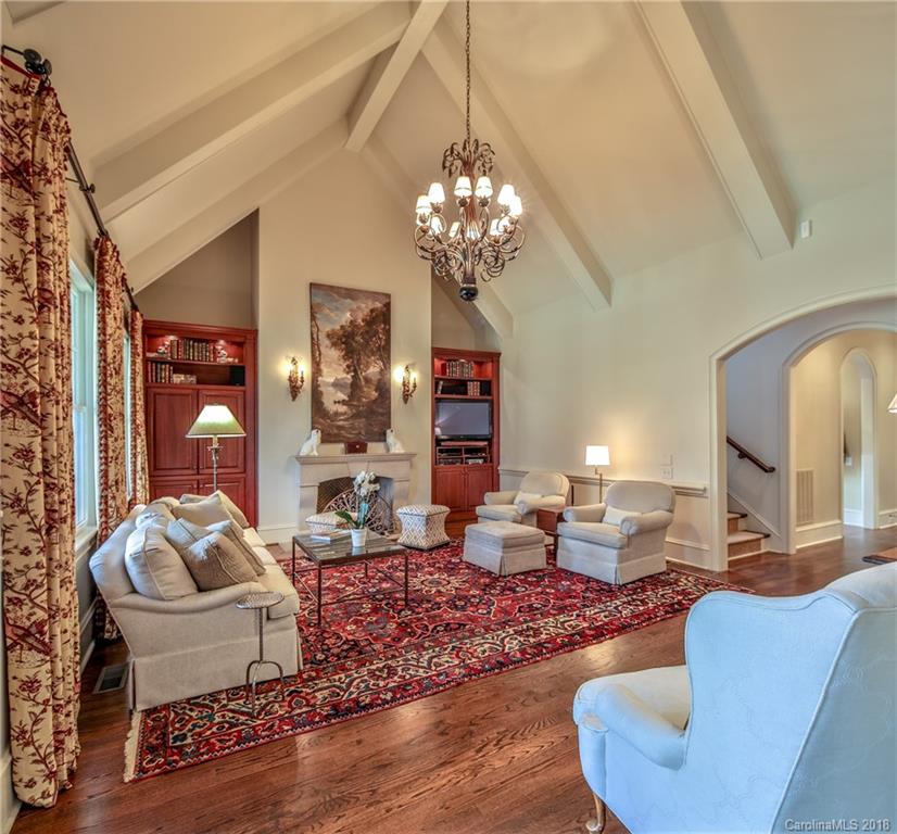 2000 Harris Road Charlotte, NC 28211 - Photo 15 of 34 a living room with fireplace furniture and a chandelier