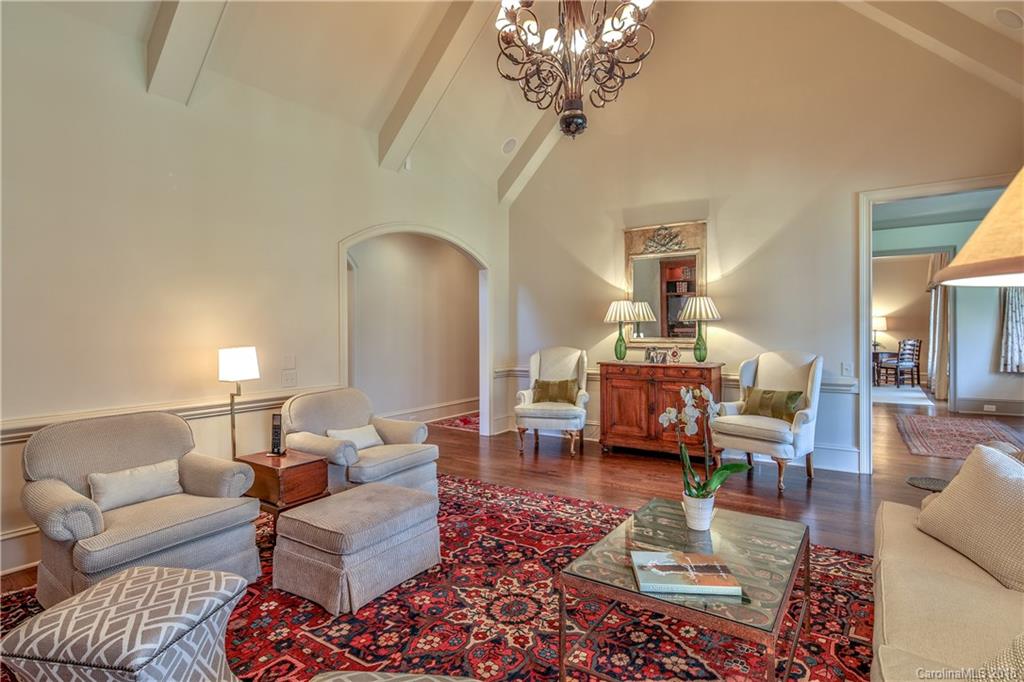 2000 Harris Road Charlotte, NC 28211 - Photo 16 of 34 a living room with furniture chandelier and a table