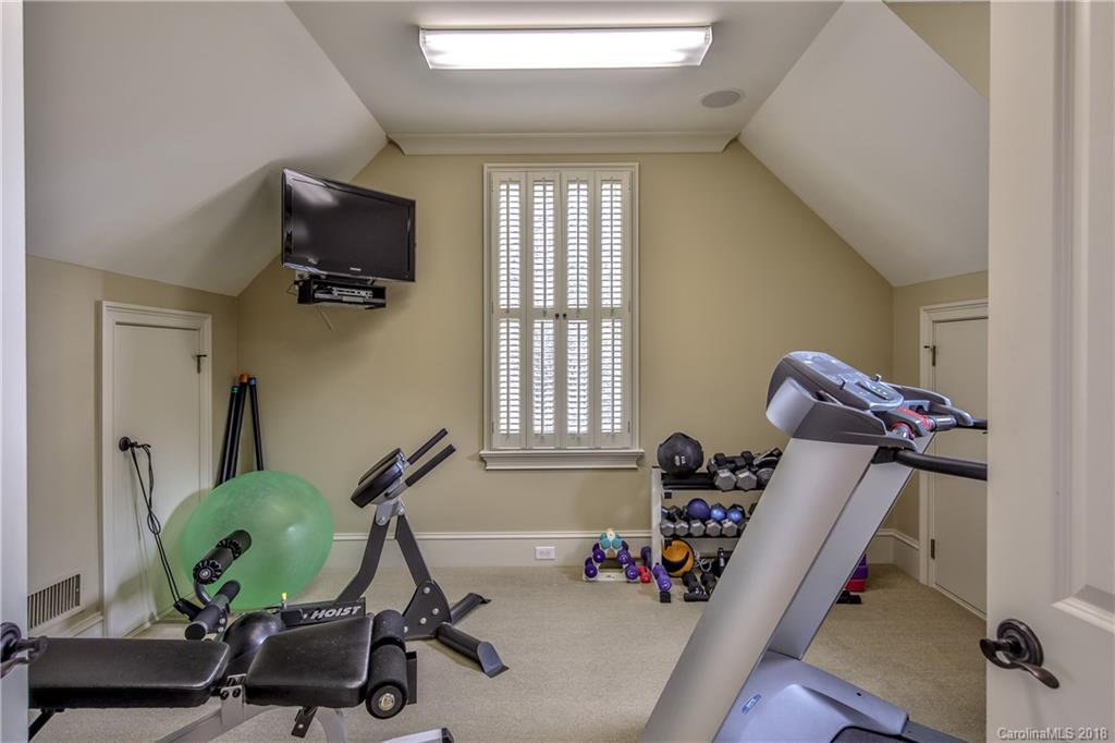 2000 Harris Road Charlotte, NC 28211 - Photo 26 of 34 a room with gym equipment and windows