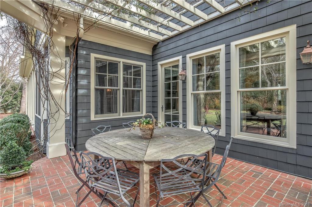 2000 Harris Road Charlotte, NC 28211 - Photo 29 of 34 a table and chairs in front of a house