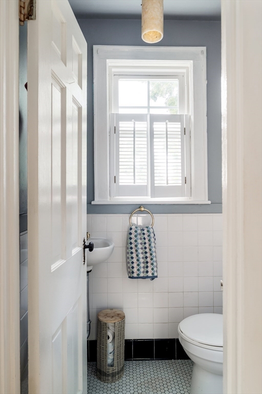 7 St Marys Road Milton, MA 02186 - Photo 12 of 31 a bathroom with a toilet a sink and a window