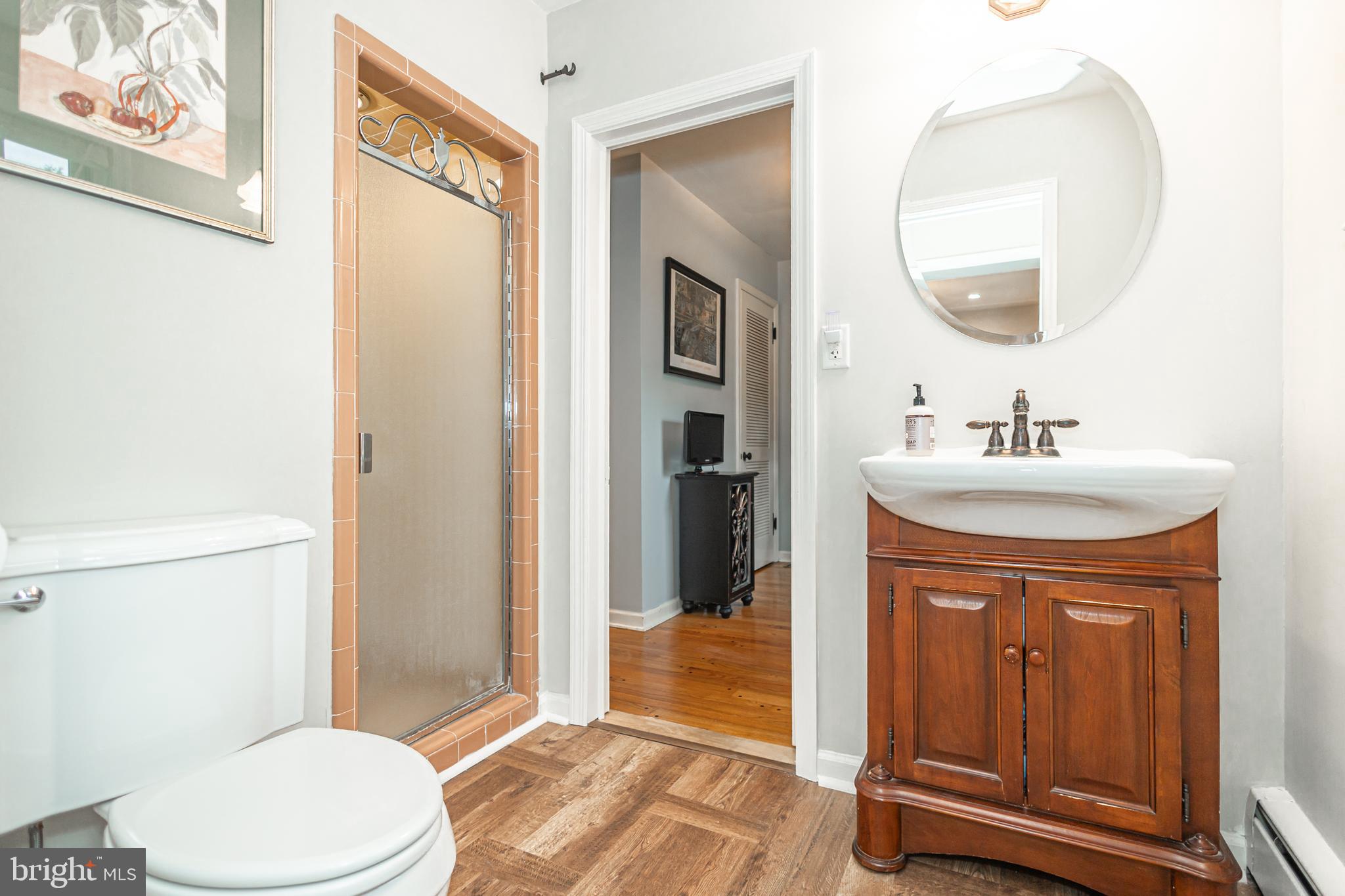1184 Shannon Road Newtown, PA 18940 - Photo 24 of 58 a bathroom with a sink a toilet and shower