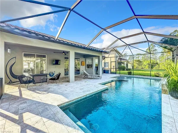 a view of a swimming pool with a patio