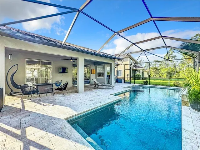 a view of a swimming pool with a patio