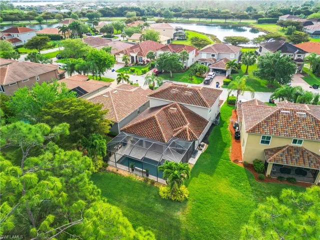 an aerial view of a house with outdoor space and street view