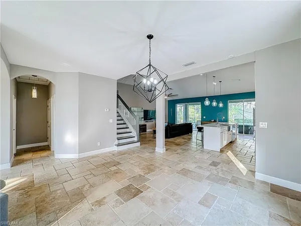 a view of a livingroom with a chandelier and living room