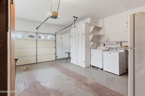 a view of a patio with couches and a flat tv screen
