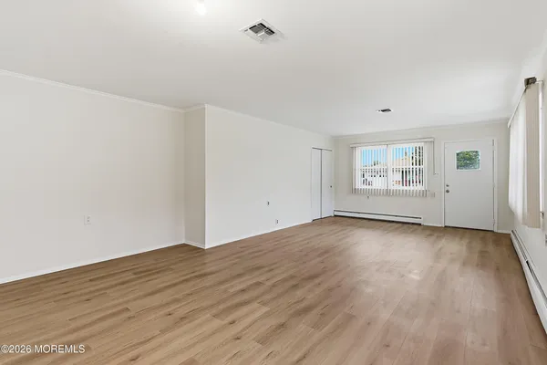 a kitchen with stainless steel appliances granite countertop a refrigerator a sink dishwasher a stove with white cabinets