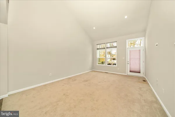 a view of a hallway with wooden furniture and livingroom