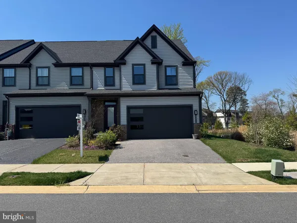 a front view of a house with yard