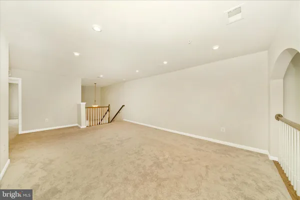 a bathroom with a white bath tub and a toilet