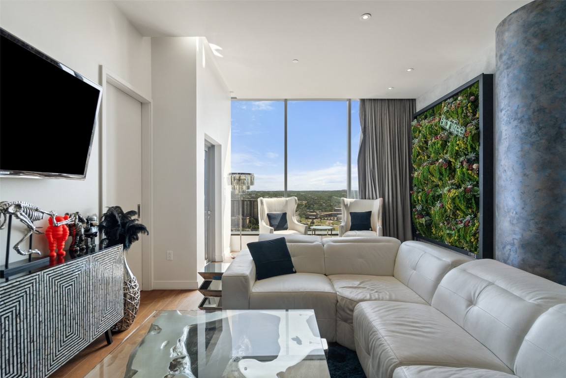 210 Lavaca Street, Unit 2203 Austin, TX 78701 - Photo 19 of 30 a living room with furniture and a flat screen tv