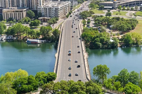 an aerial view of a house with a lake view