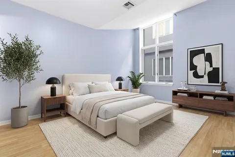 a bedroom with a large bed and a couch