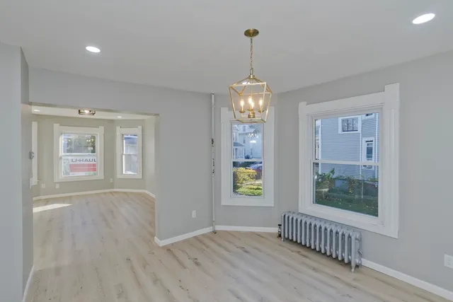 a view of livingroom with window and hardwood floor