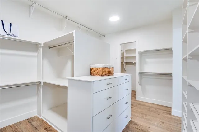 a kitchen with cabinets and window