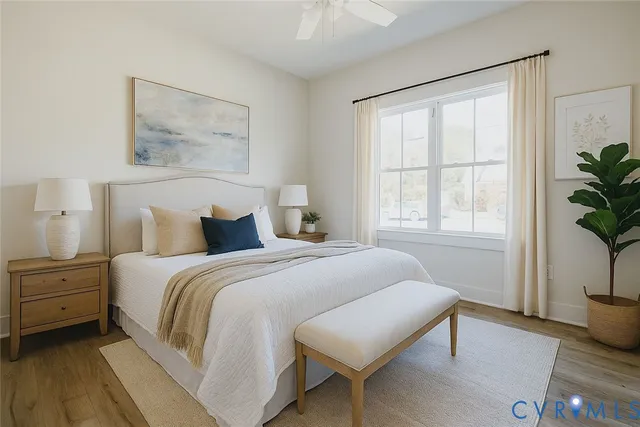 a spacious bedroom with a bed and a window