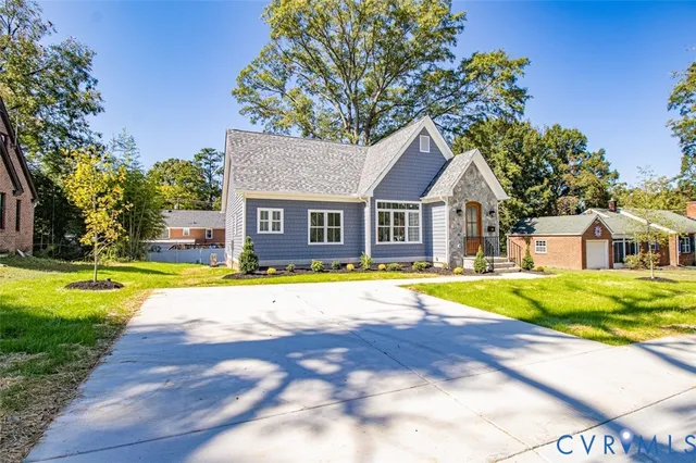 a house with swimming pool in front of it