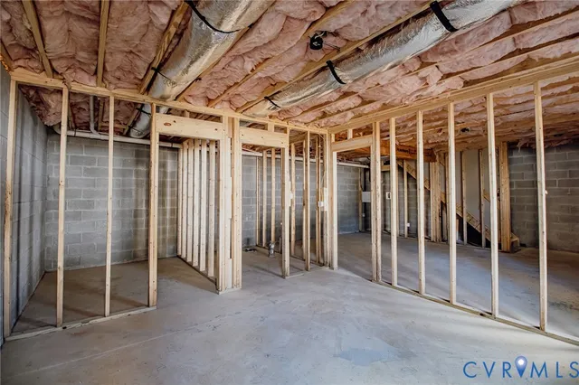 a view of empty room with wooden walls