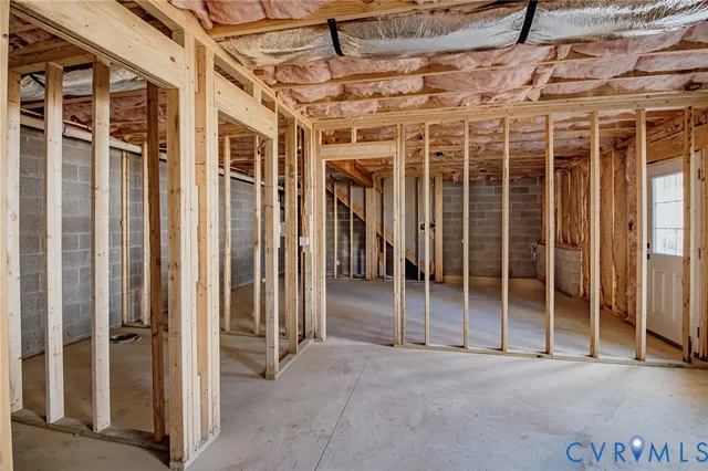 a view of empty room with wooden walls