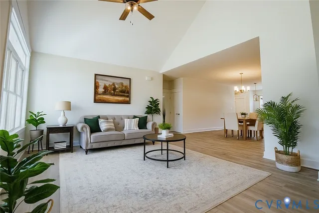 a living room with furniture and a potted plant