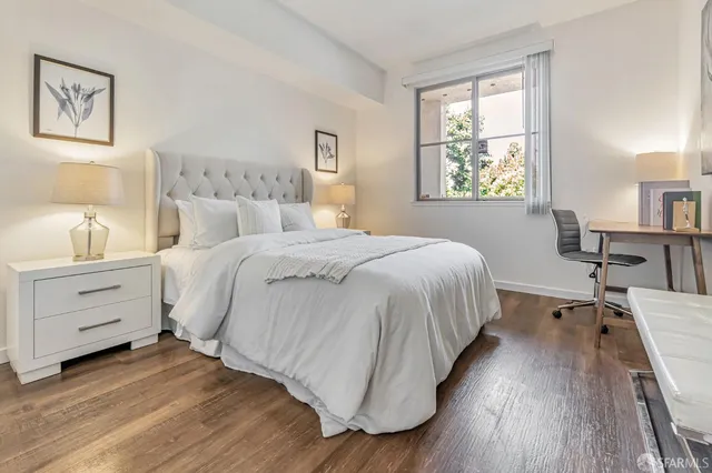 a bed room with a bed and a window