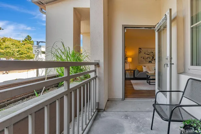a view of a porch with furniture and garden