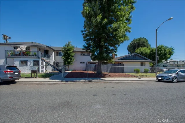 a view of street with parked cars