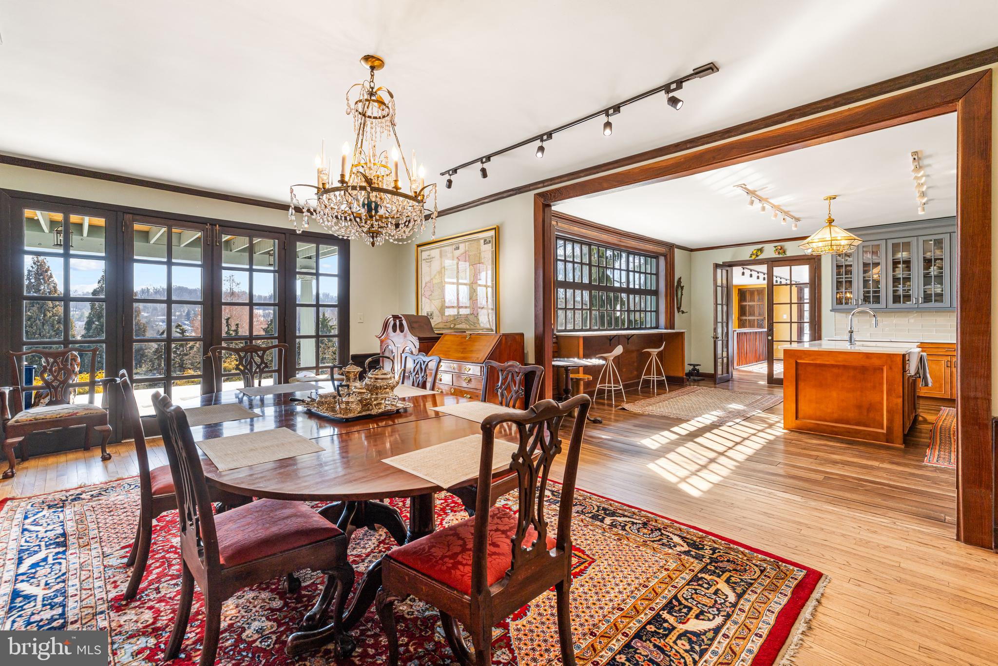 1260 County Line Road Wayne, PA 19087 - Photo 17 of 64 a view of a dining room and livingroom with furniture wooden floor a chandelier