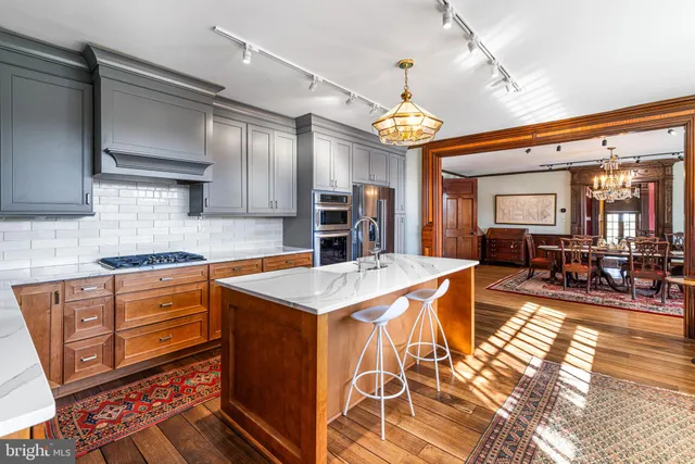 a room with a bed and wooden floor