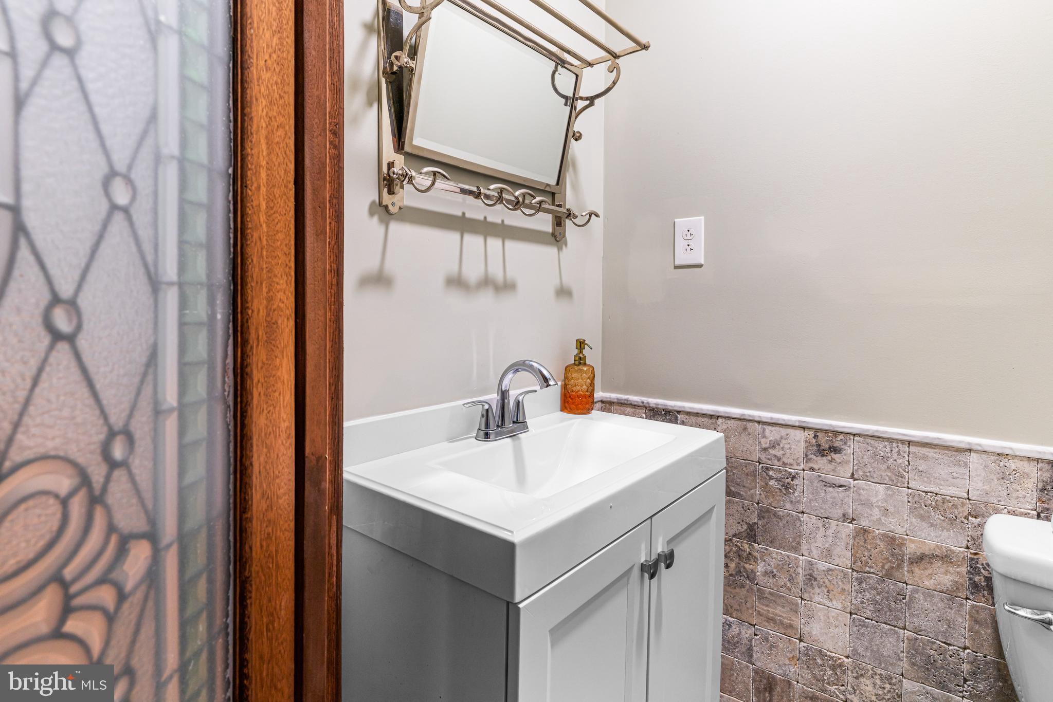1260 County Line Road Wayne, PA 19087 - Photo 25 of 64 a bathroom with a sink and vanity