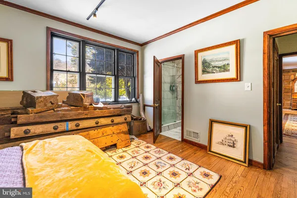 a bedroom with furniture and a chandelier