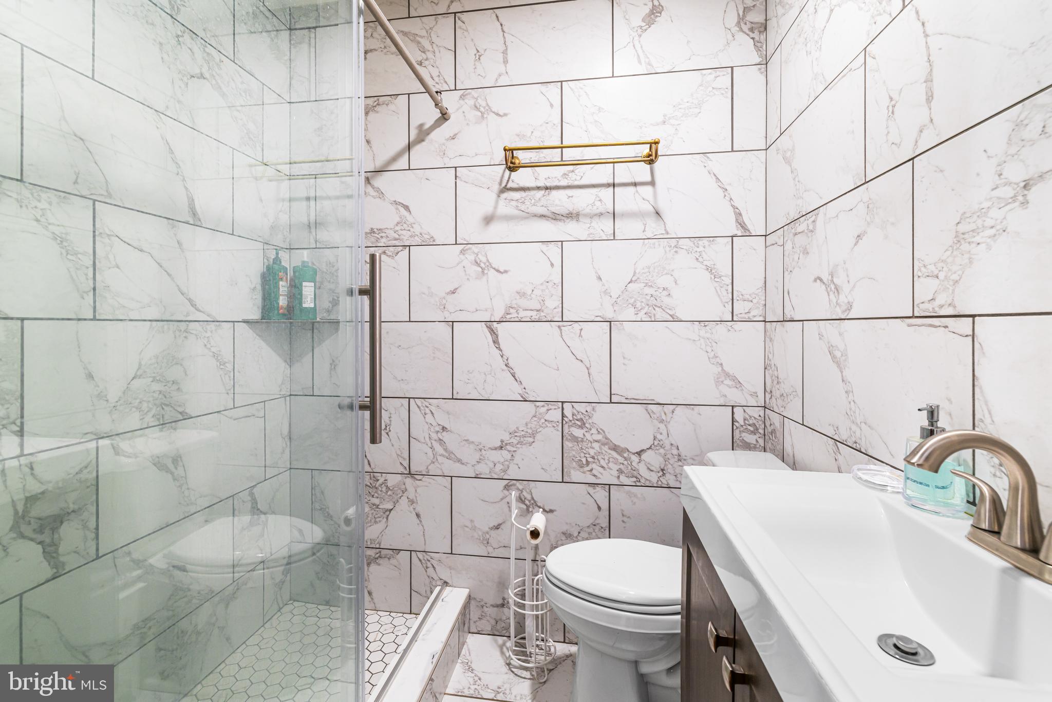 1260 County Line Road Wayne, PA 19087 - Photo 27 of 64 a bathroom with a sink toilet and shower