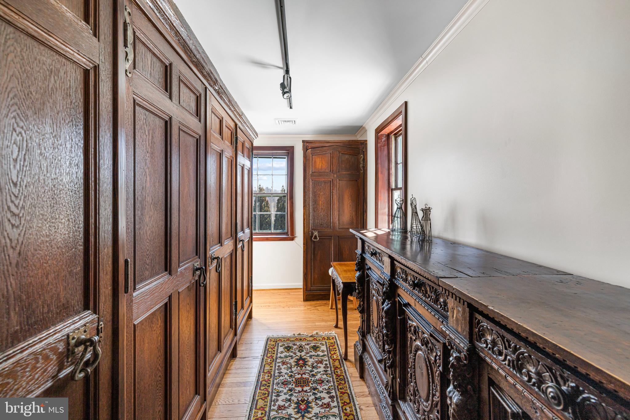 1260 County Line Road Wayne, PA 19087 - Photo 34 of 64 a view of a hallway with wooden floor and stairs
