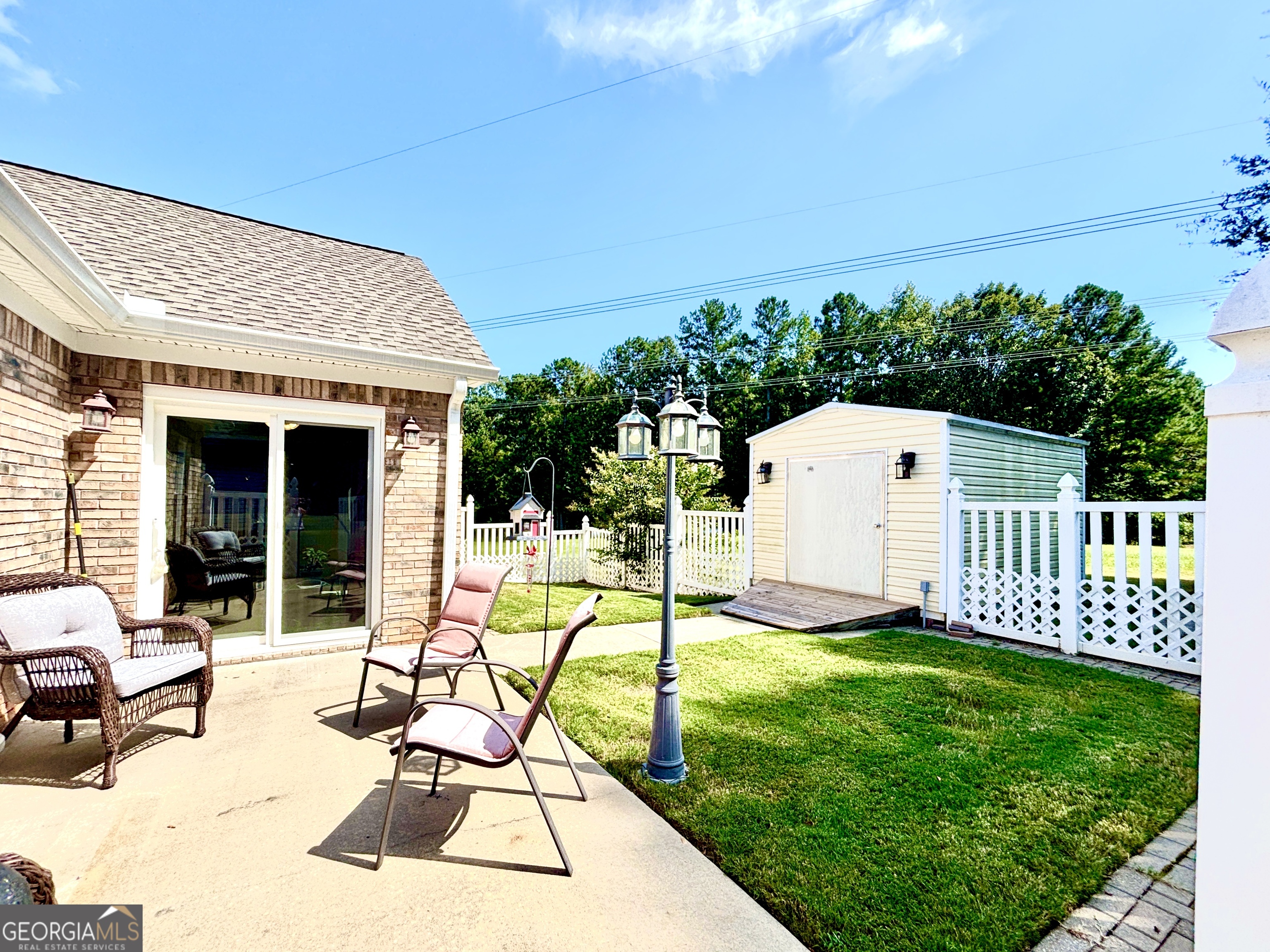 1102 Strath Clyde Way McDonough, GA 30253 - Photo 12 of 23 a view of a house with backyard and sitting area