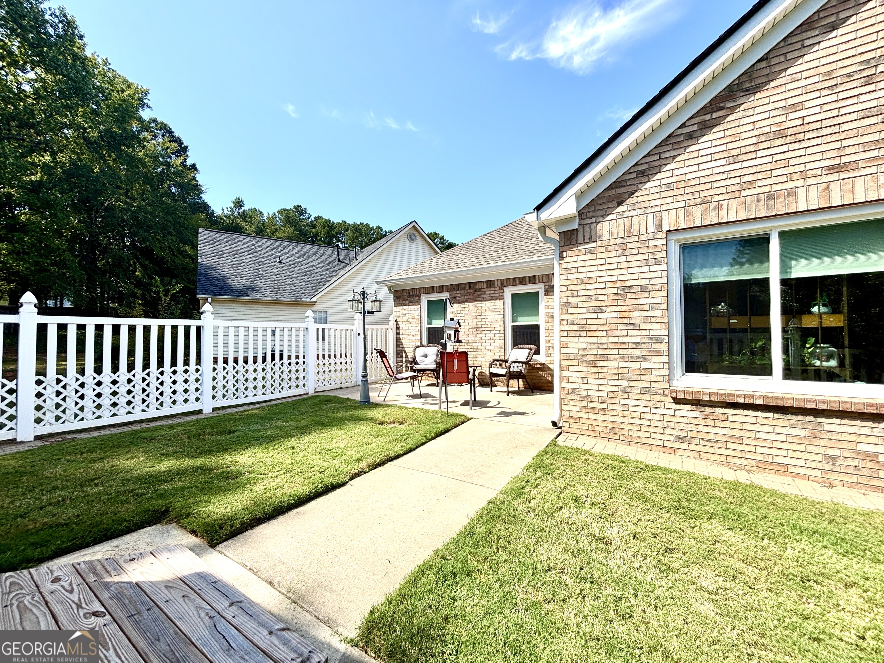 1102 Strath Clyde Way McDonough, GA 30253 - Photo 16 of 23 a view of a house with a yard and deck