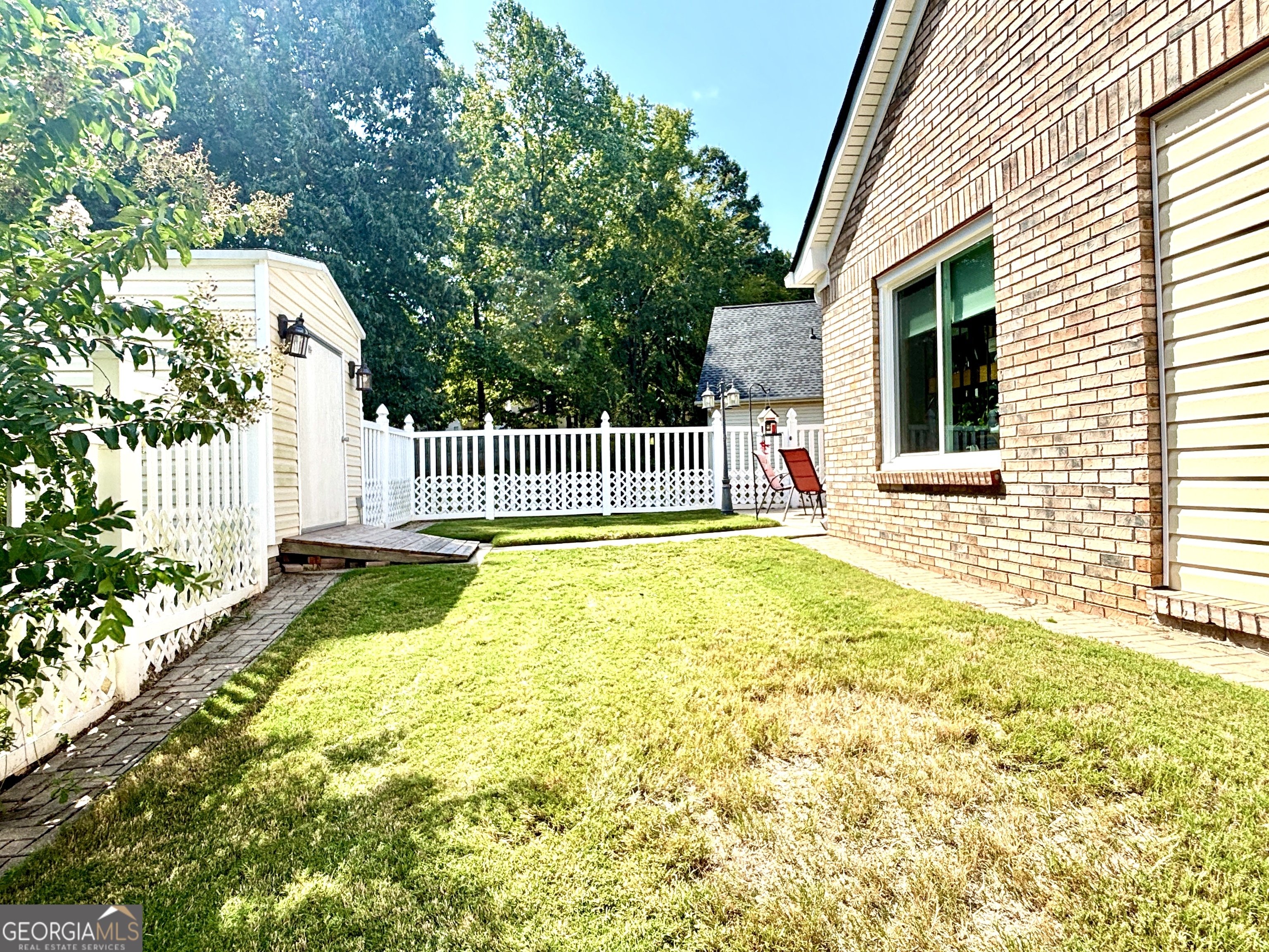 1102 Strath Clyde Way McDonough, GA 30253 - Photo 17 of 23 a view of house with backyard and porch
