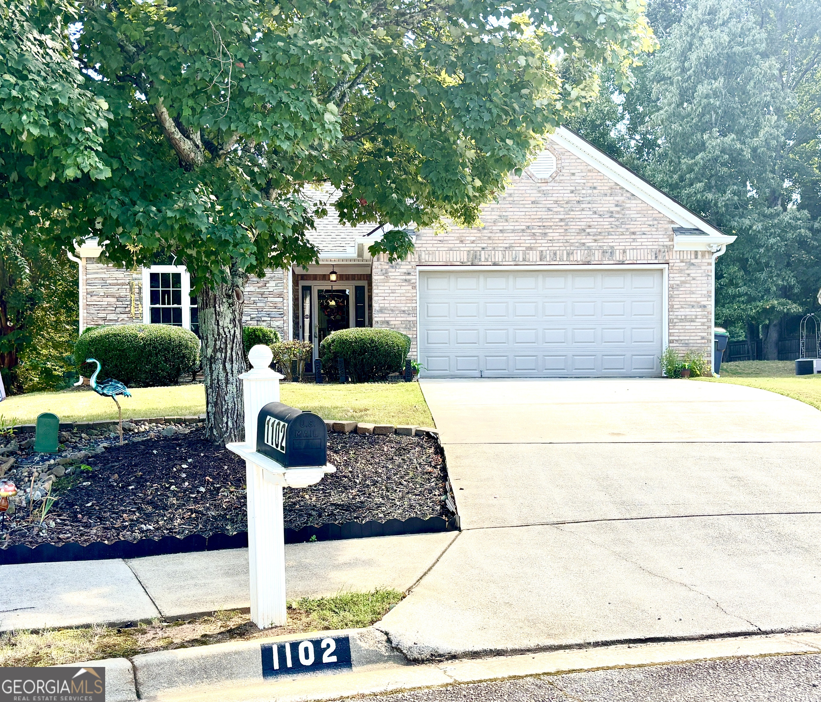 1102 Strath Clyde Way McDonough, GA 30253 - Photo 4 of 23 a front view of a house with garden
