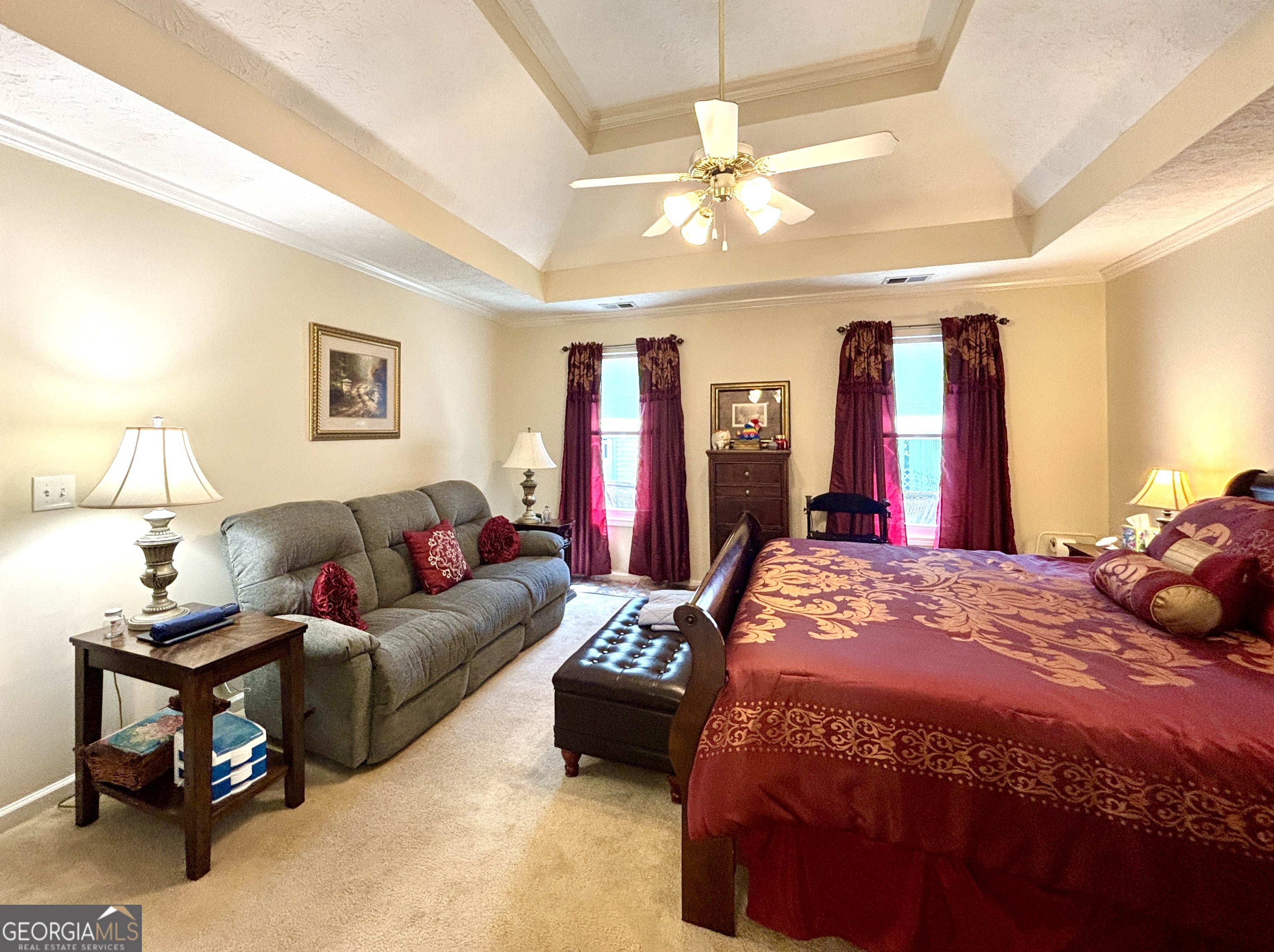 1102 Strath Clyde Way McDonough, GA 30253 - Photo 9 of 23 a living room with furniture a chandelier and a flat screen tv