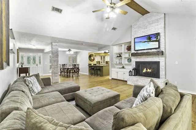 a living room with furniture and a fireplace