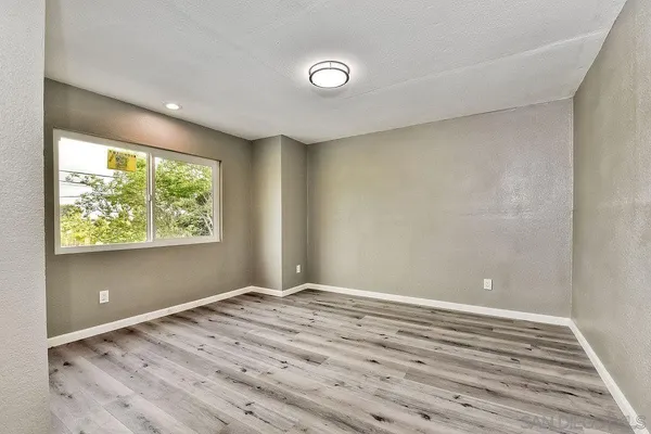 a view of room with window and ceiling fan