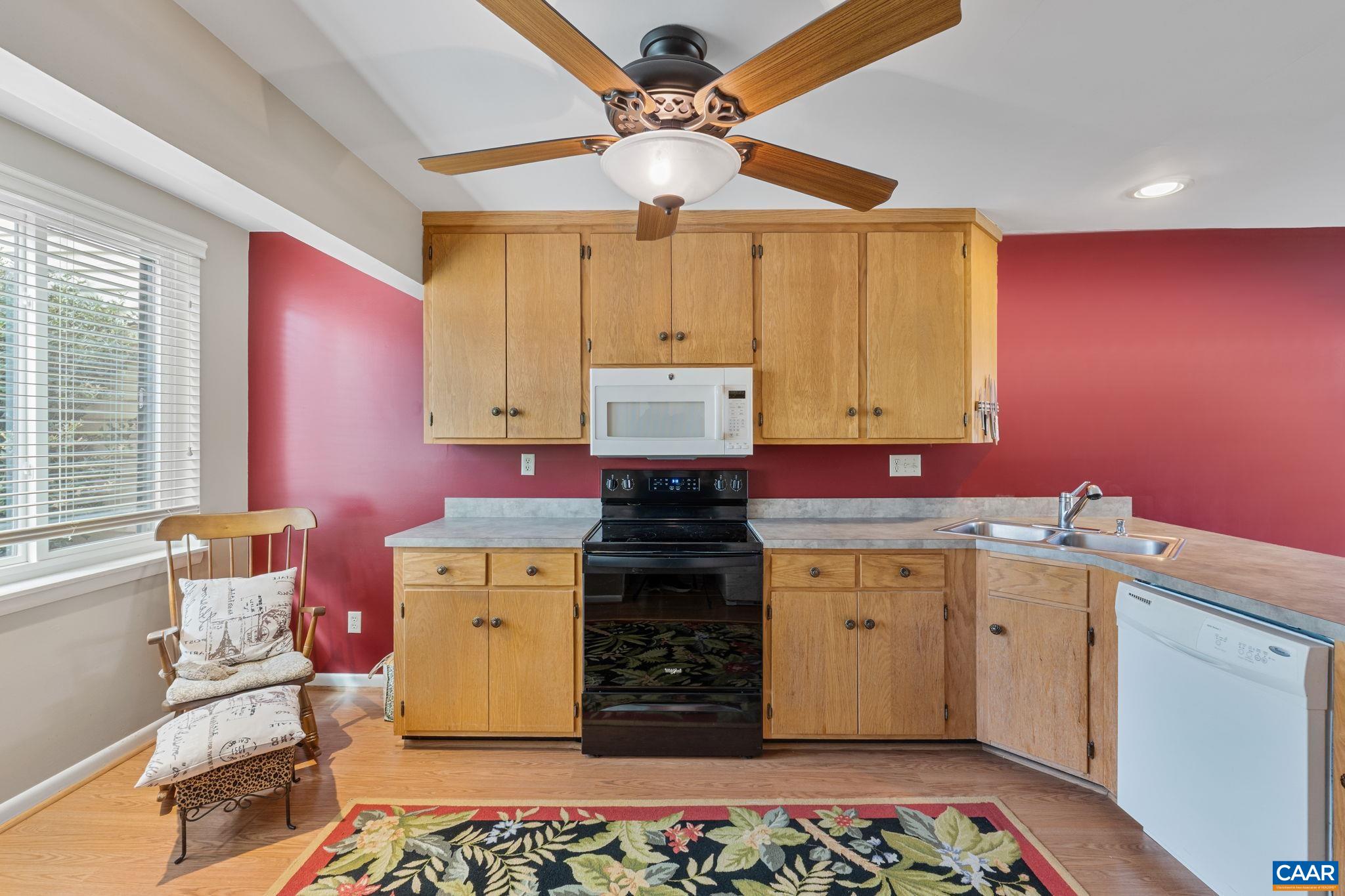 1212 Chatham Ridge Charlottesville, VA 22901 - Photo 5 of 17 a kitchen with a stove and cabinets