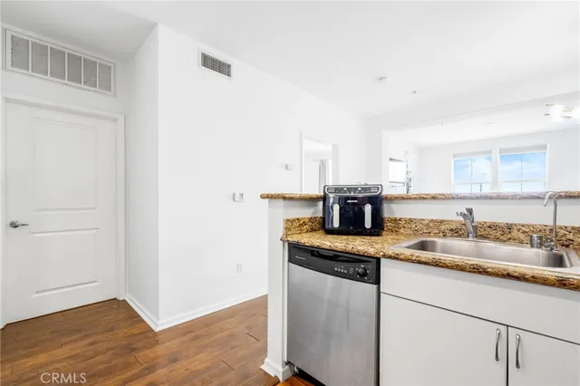 a kitchen with a sink and a stove