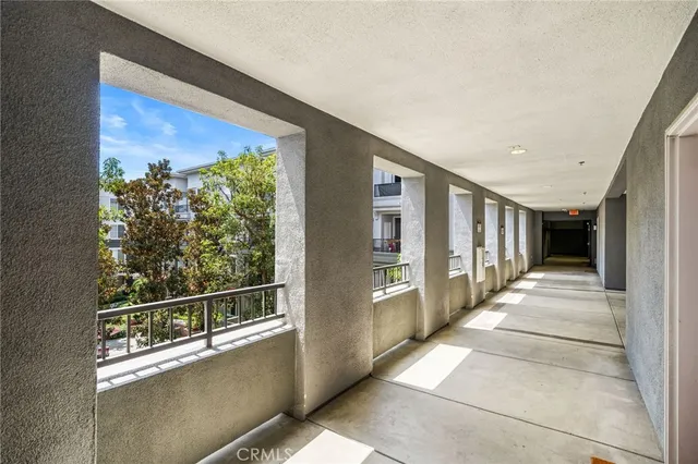a view of a patio with dining table and chairs