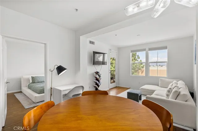 a bed room with two bed and a large window