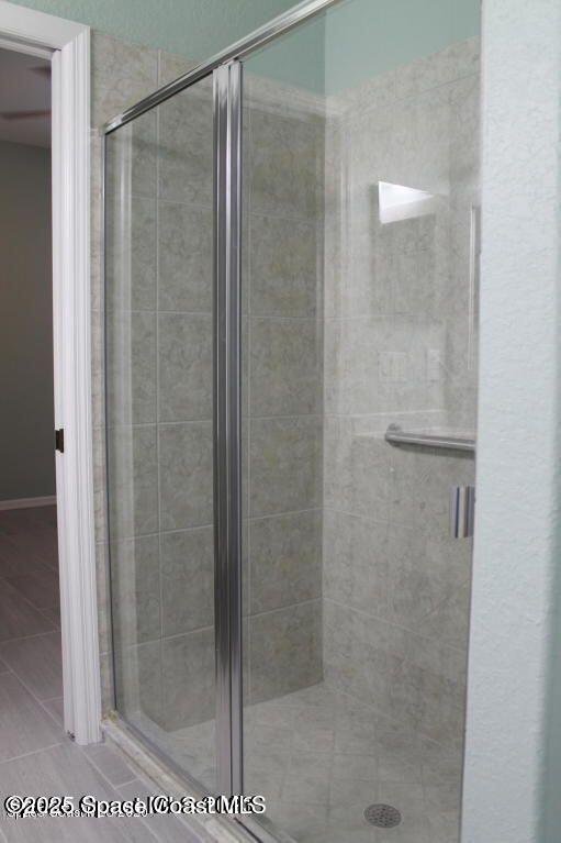 3121 Atocha Lane Indialantic, FL 32903 - Photo 12 of 17 a bathroom with a glass shower door